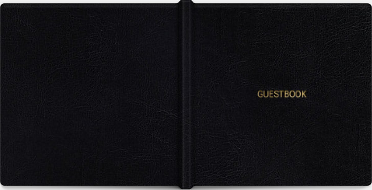 The Bespoke Guestbook closed, a black leather 10 by 10 layflat book with GUESTBOOK stamped in gold foil